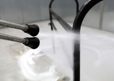 Enclosed wash booth system sprayer