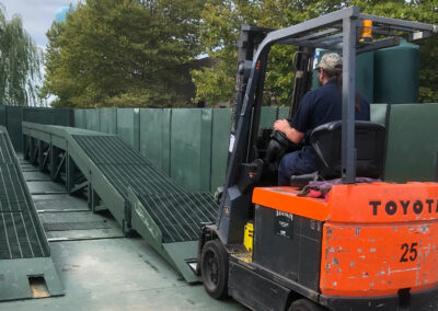 Forklift getting ready to load into the vehicle wash system