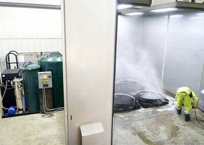 man in yellow suit using intermediate water treatment system