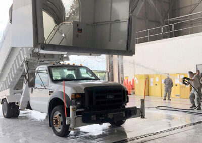 Wide angle of in-hangar aircraft washing system