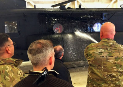 Back angle of people using the total aircraft washing system indoors