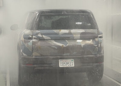 Rain testing system focused on back of camo wrapped car