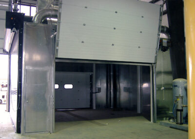 Concrete Form Wash Bay, large metal structure with open door