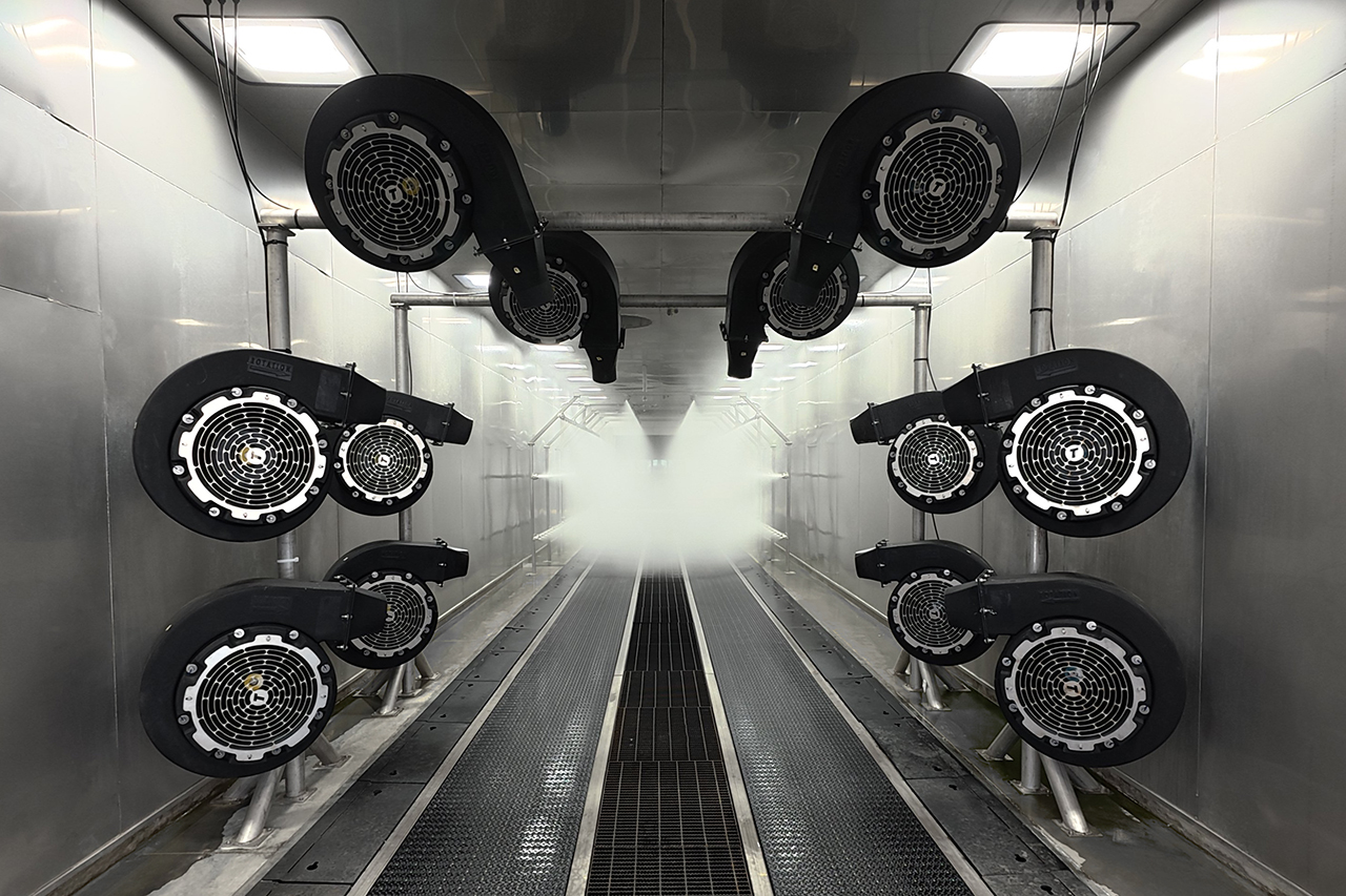 Inside a rain test booth with water running