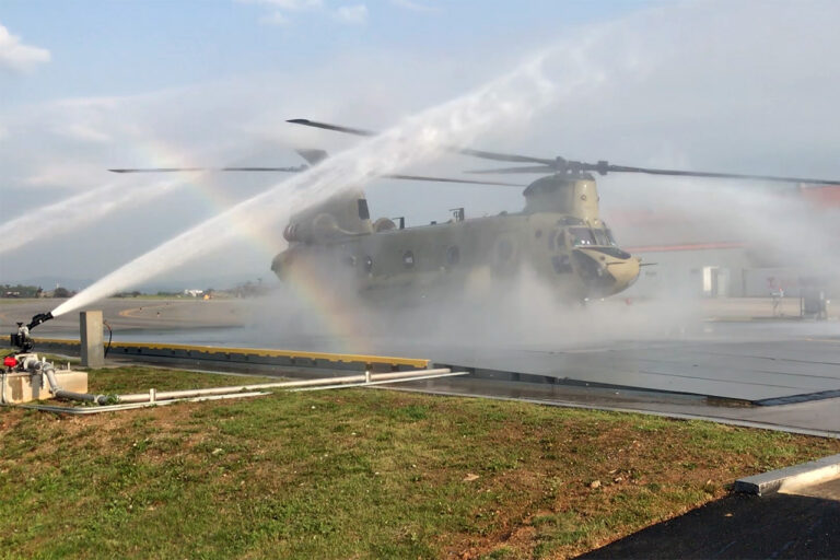 Chinook being sprayed by TRS water cannons