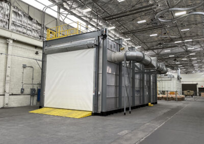 Enclosed Wash Booth inside large warehouse building