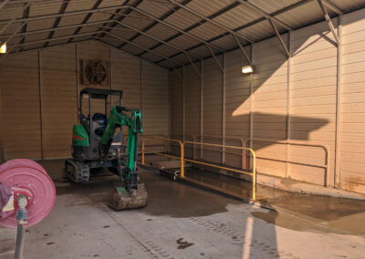 Heavy Mud Rental Equipment In Wash Bay With Sump Pit